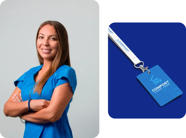 Comfort Home Care Caregiver With Branded Employee ID Badge | Comfort Home Care Professional Comfort Home Care caregiver in blue scrubs beside a branded employee ID badge